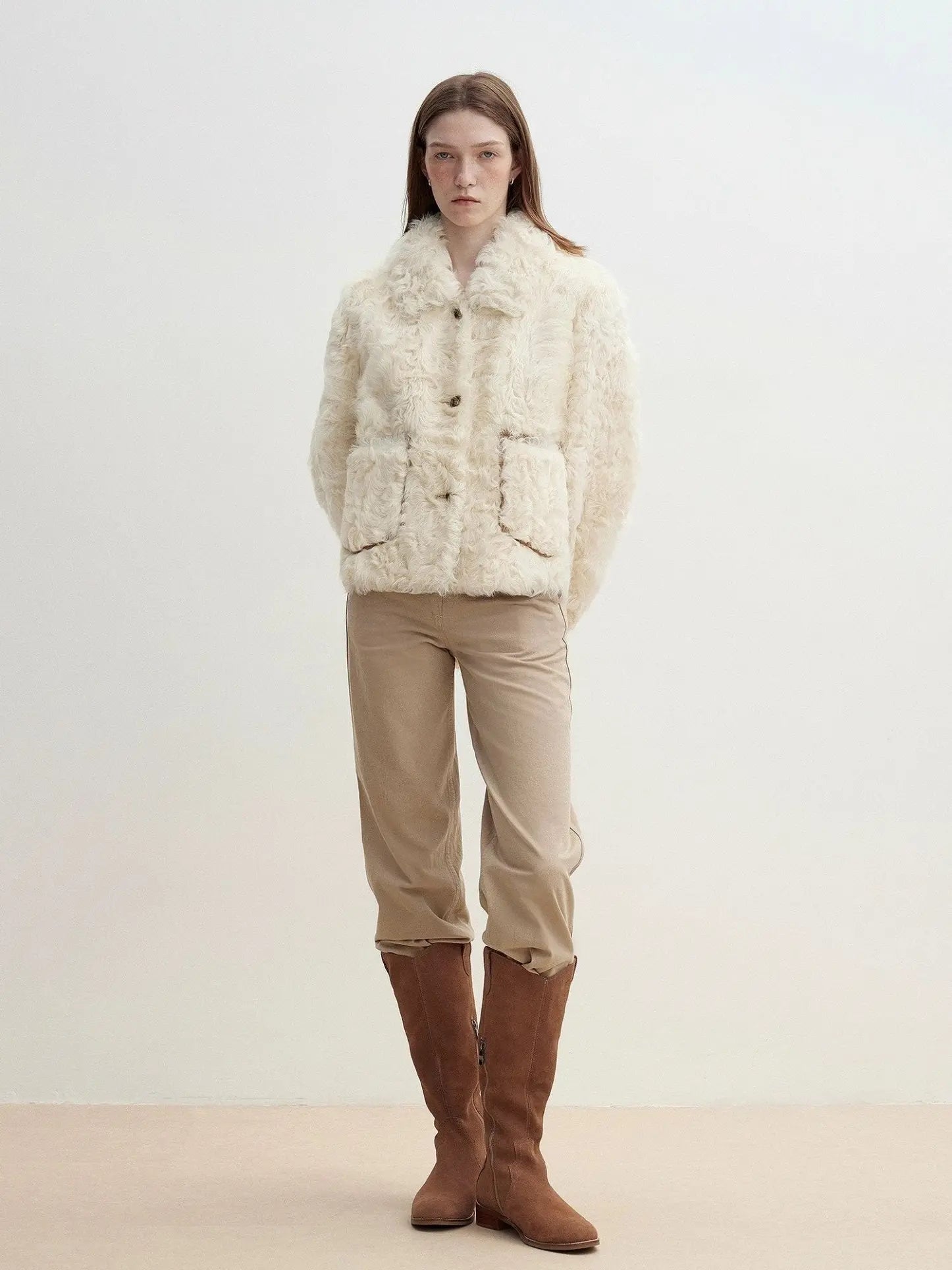 Model wearing the Rachel off-white two-tone curly wool shearling coat, relaxed full-length view