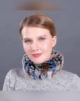 Woman wearing a multicolor rex rabbit fur elastic woven neck scarf