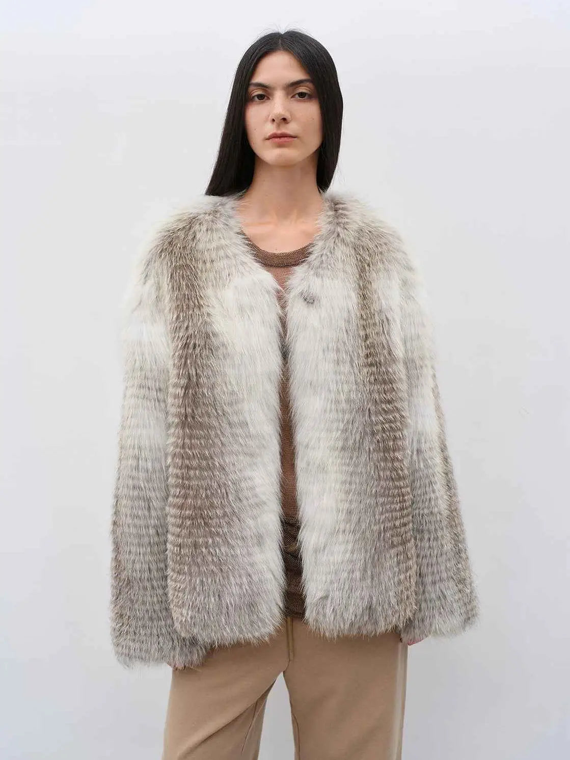 Model wearing Romantic Nordic Sunburst Fox fur coat, front view