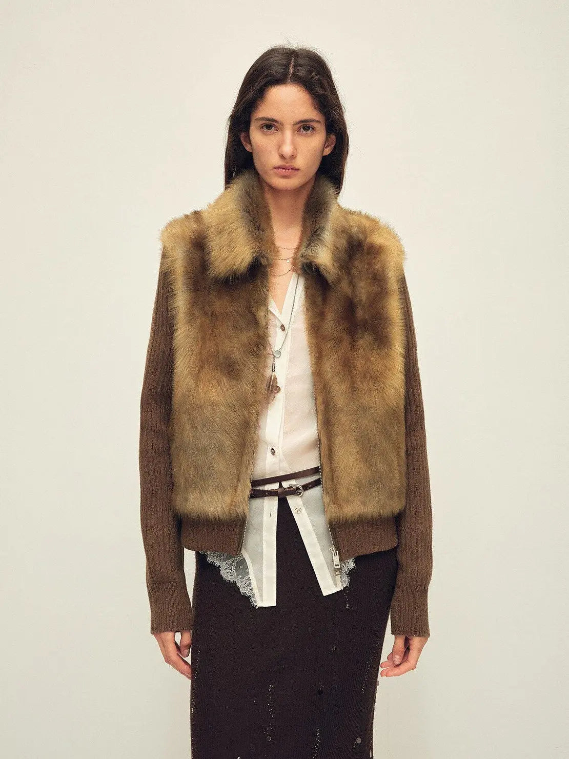 Model wearing the Silky Cocoa amber brown shearling coat, front view