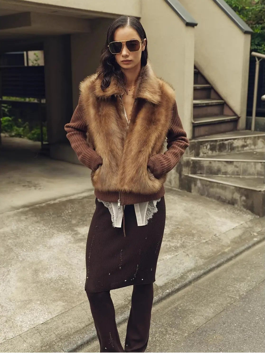 Model styling the Silky Cocoa amber brown shearling coat outdoors