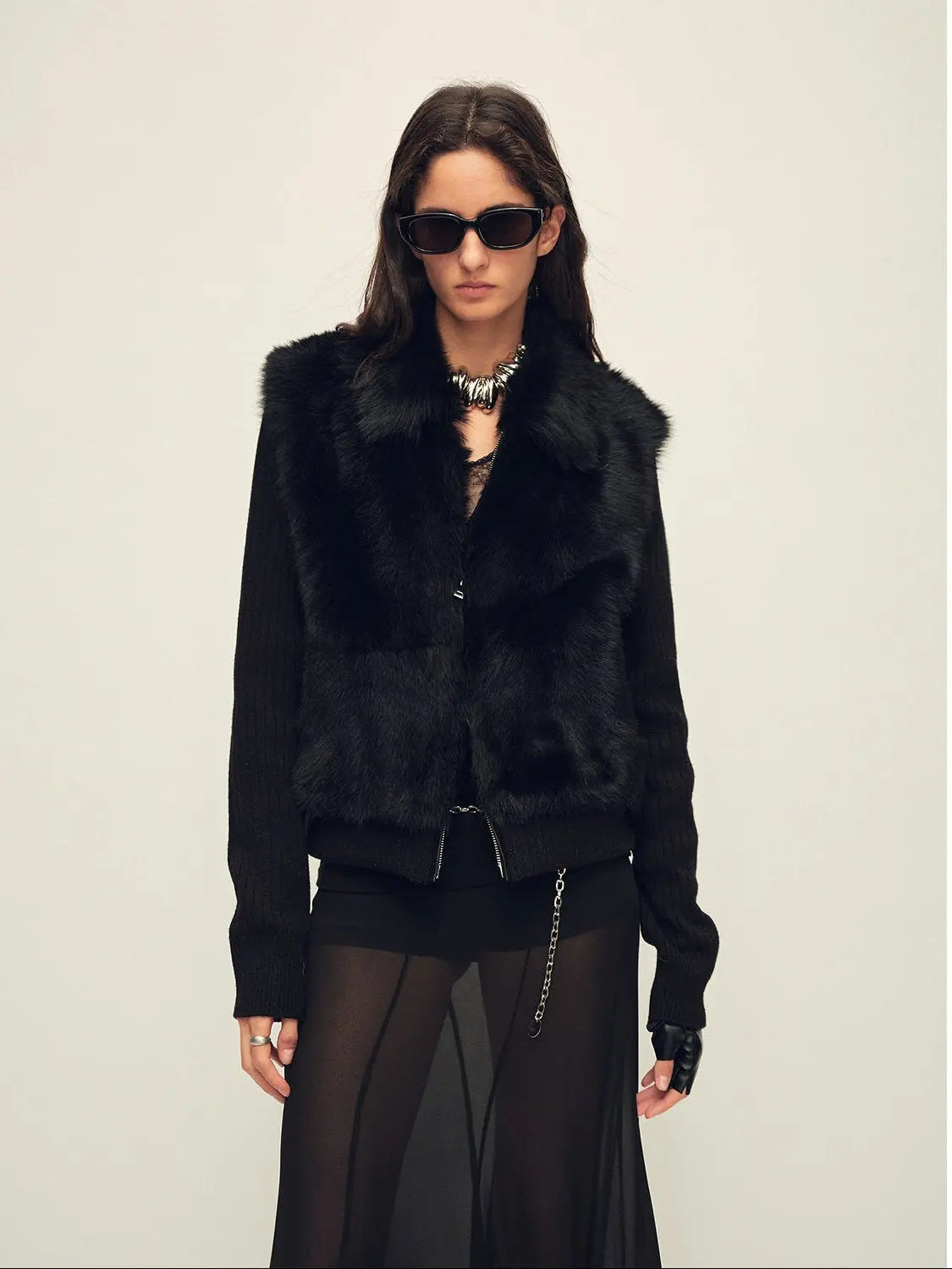 Model wearing the Silky Cocoa black shearling coat, close front view