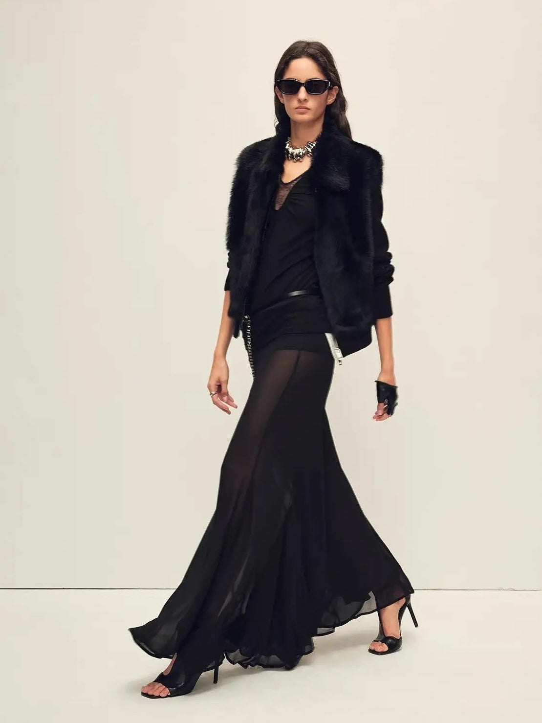 Model wearing the Silky Cocoa black shearling coat, full-length view