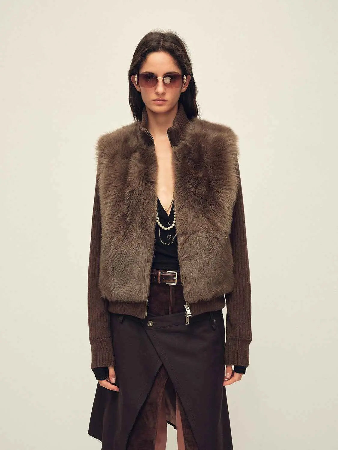 Model wearing the Silky Cocoa cocoa brown shearling coat with detachable sleeves