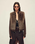 Model wearing the Silky Cocoa cocoa brown shearling coat with detachable sleeves