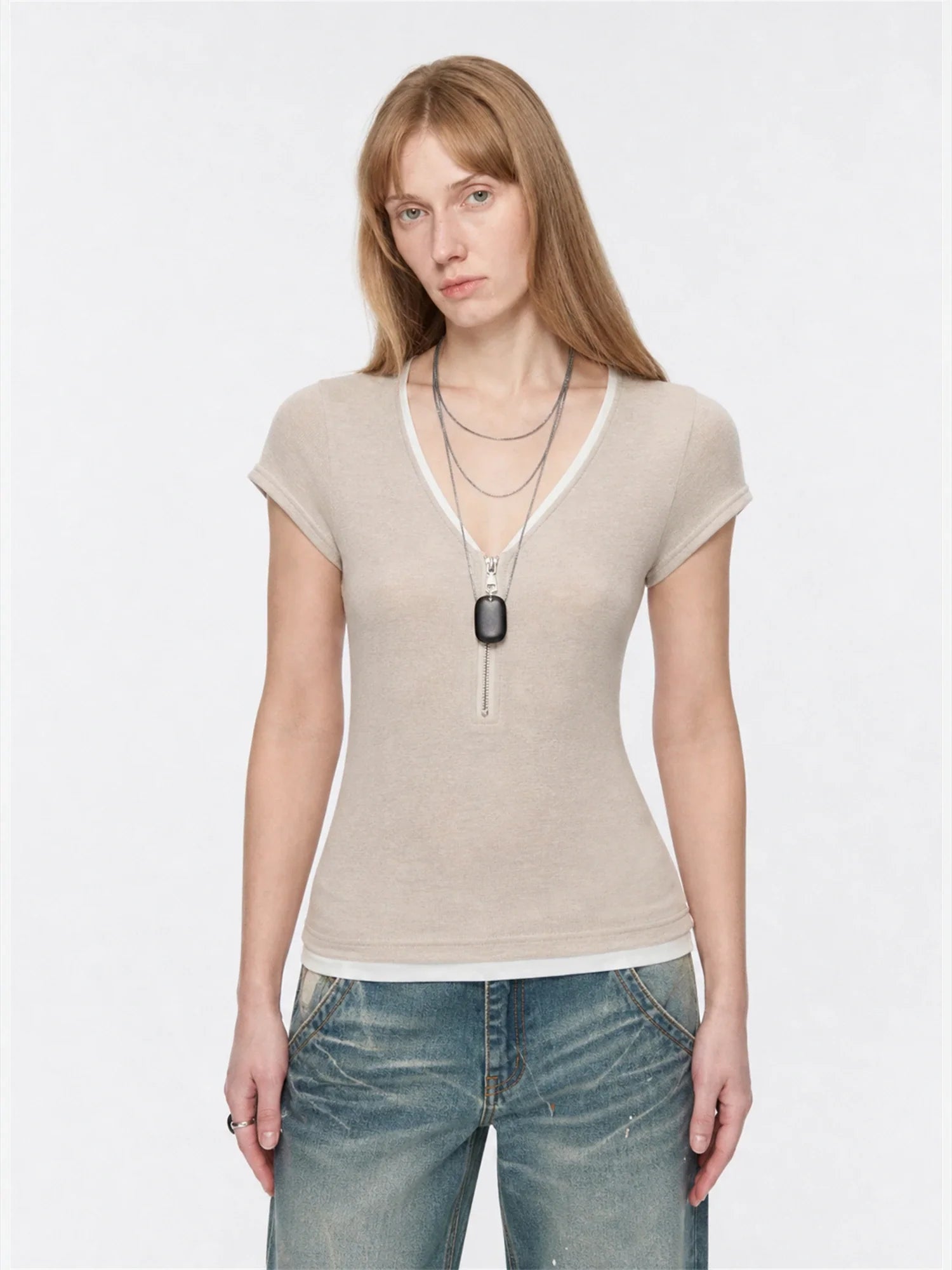 Flower Ash merino wool Tencel deep V-neck zipper short sleeve top on model front view