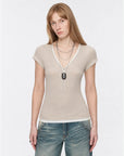 Flower Ash merino wool Tencel deep V-neck zipper short sleeve top on model front view