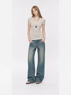 Flower Ash merino wool Tencel deep V-neck zipper short sleeve top on model full front view