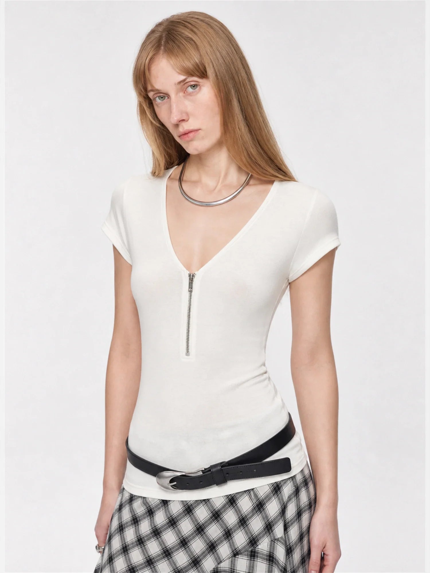 Original White merino wool Tencel deep V-neck zipper short sleeve top on model angled view