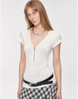 Original White merino wool Tencel deep V-neck zipper short sleeve top on model angled view