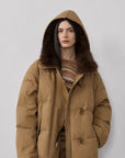Model wearing Fireladyfur Street Badge Yellow Brown hooded down parka with fox fur trim front view