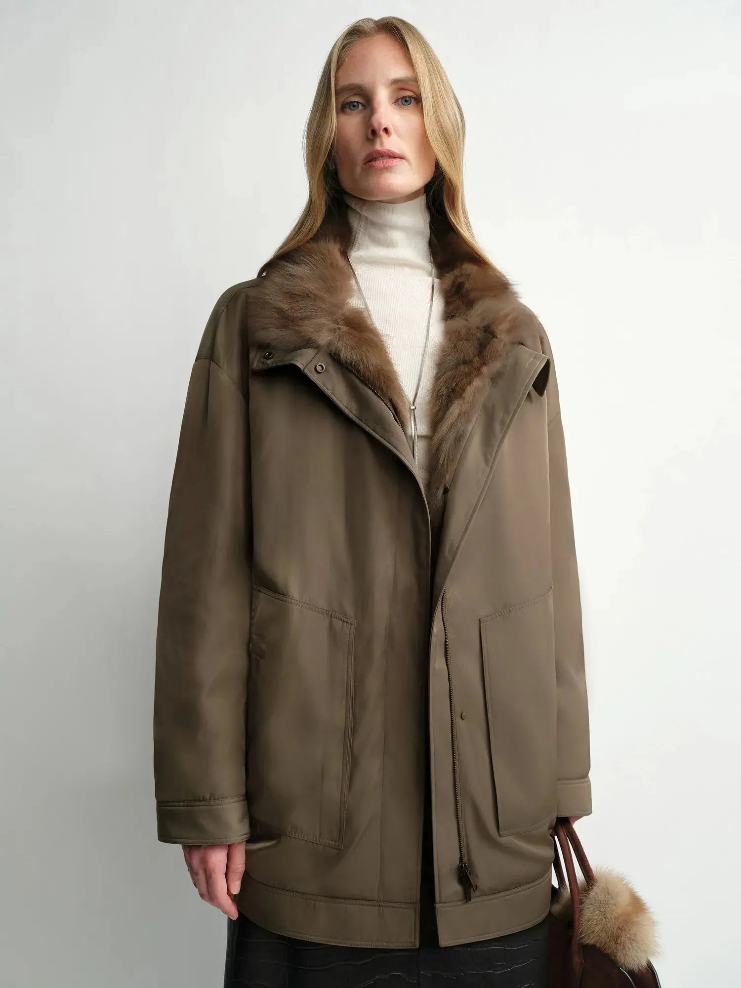 Model wearing THE ARTM women's Yellow-green detachable fur collar nylon down parka front view