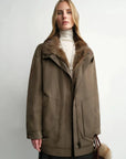 Model wearing THE ARTM women's Yellow-green detachable fur collar nylon down parka front view