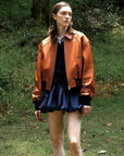 Cropped Lambskin Leather Jacket - Reddish Brown styled front view