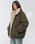 Model wearing Fireladyfur Warm Dialogue Army Green two-tone fox fur down parka open front