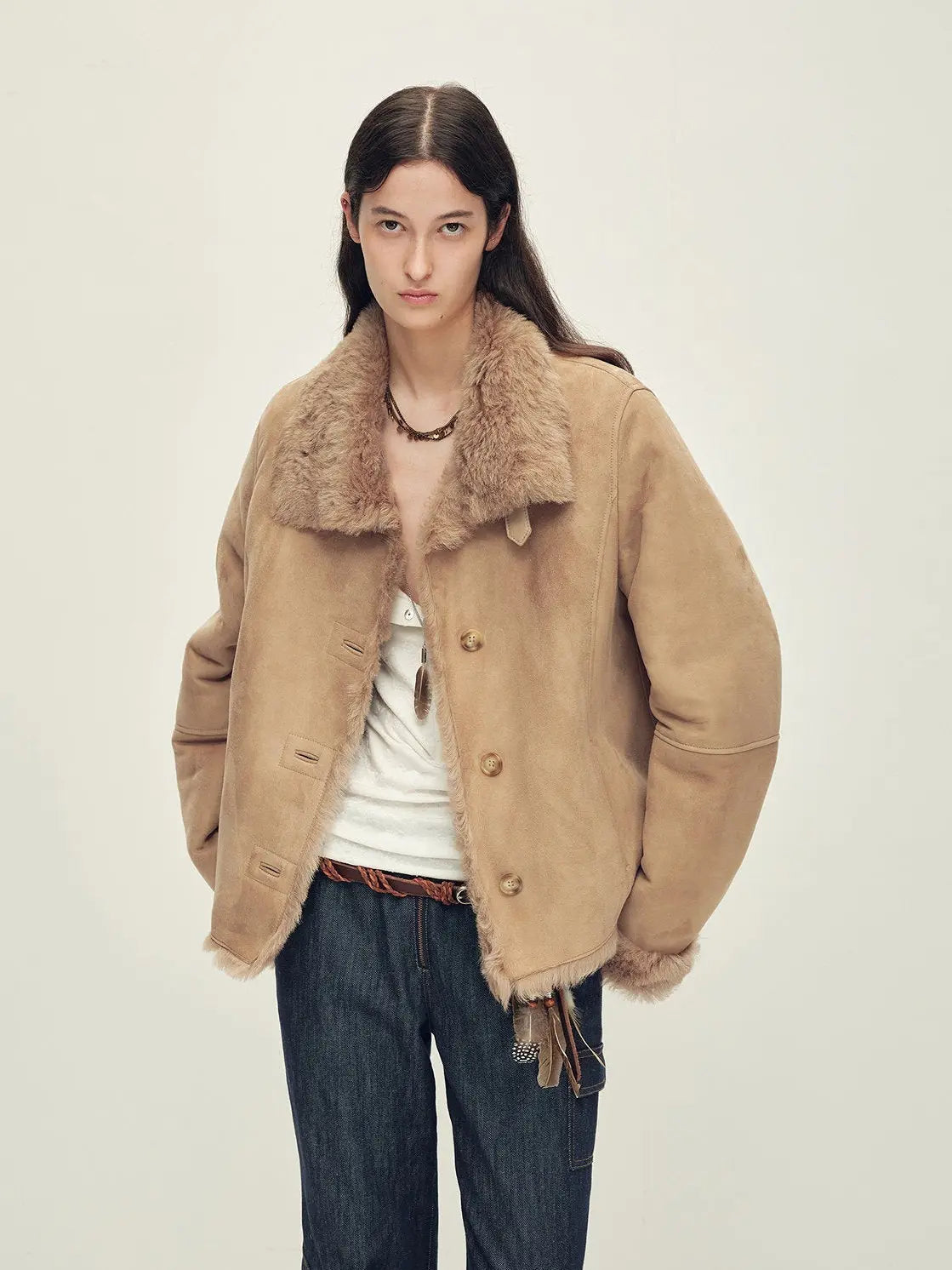 Woman wearing the Winter Mochi chestnut milk coffee shearling coat, front view