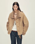 Woman wearing the Winter Mochi chestnut milk coffee shearling coat, front view
