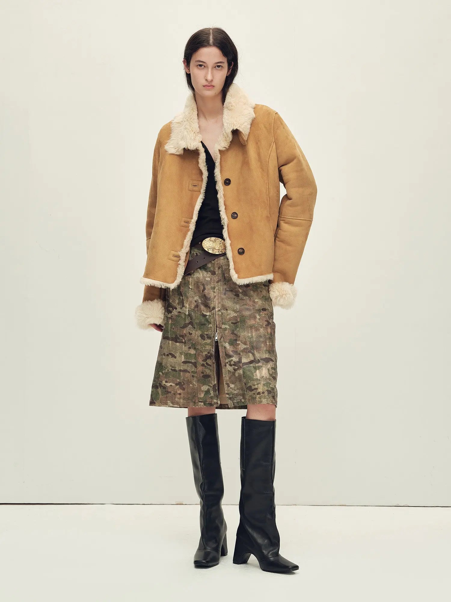 Woman styling the Winter Mochi tea apricot shearling coat, full-length view