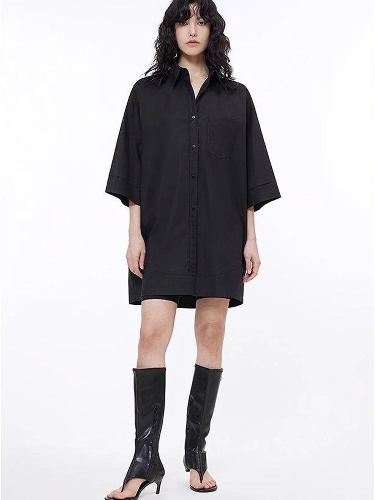 Black oversized paneled pullover shirt on model