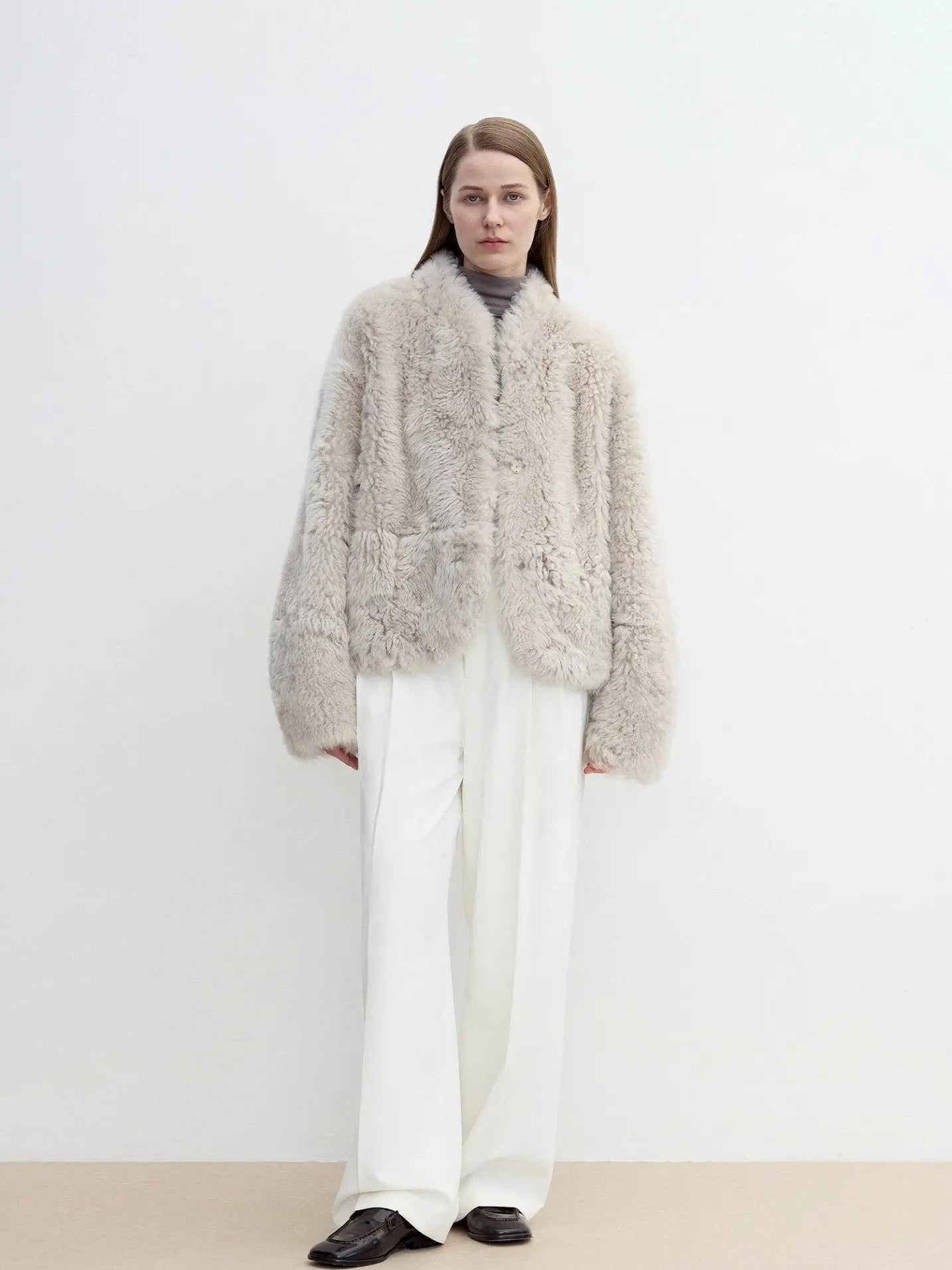 Model wearing the Yorta morning cloud gray Toscana shearling jacket