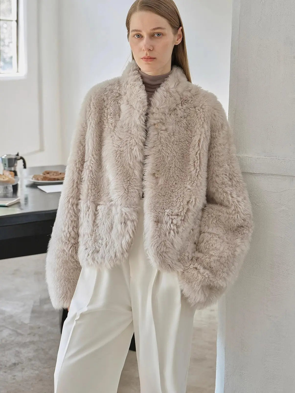 Yorta morning cloud gray curly shearling jacket styled on model