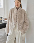 Yorta morning cloud gray curly shearling jacket styled on model