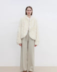 Front model view of Yorta white curly shearling jacket