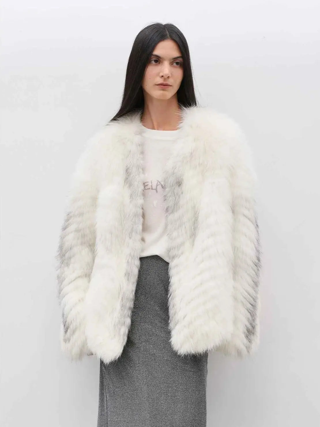 Model wearing Yukino Dream Marble Fox natural color coat, front view